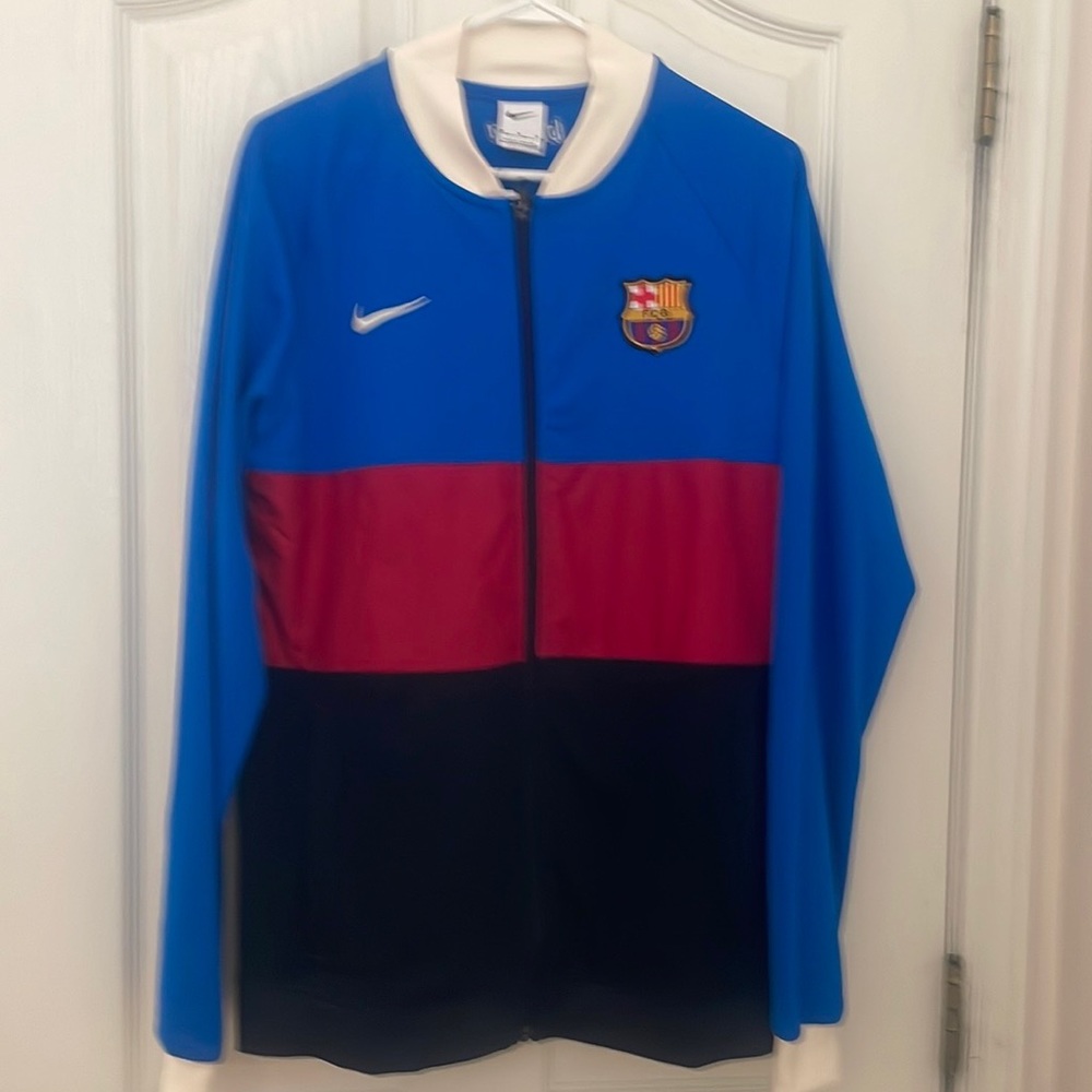 Red, blue & black Nike jacket.